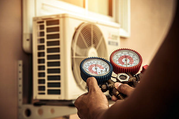 Professional Air Conditioning Service technician working in Grand Island, NE